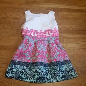 White, hot pink, teal & blue dress.